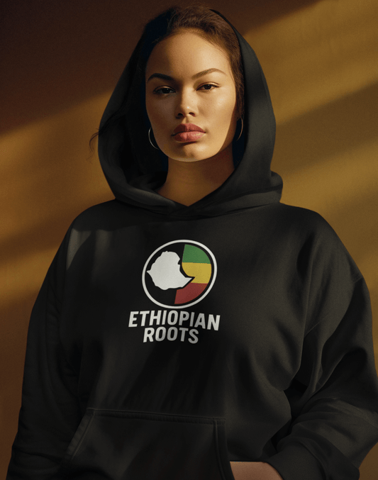 Woman wearing a black hoodie with 'Ethiopian Roots' flag and map design on a brown background