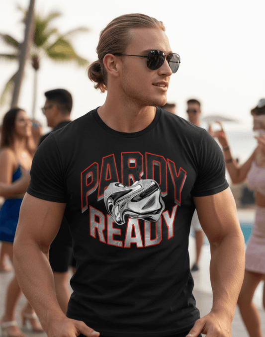 Man wearing a black carnival t-shirt with 'Pardy Ready' graphic at a party.