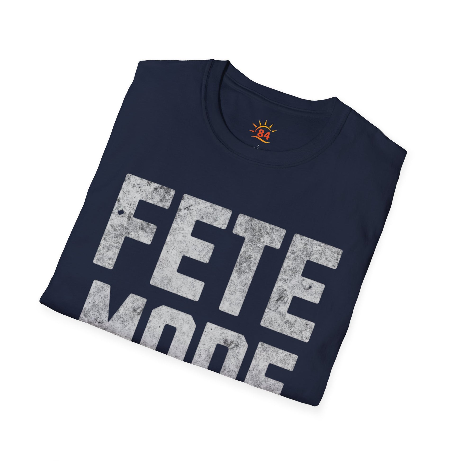 Folded Navy blue t-shirt with 'FETE MODE ON' text on a white background
