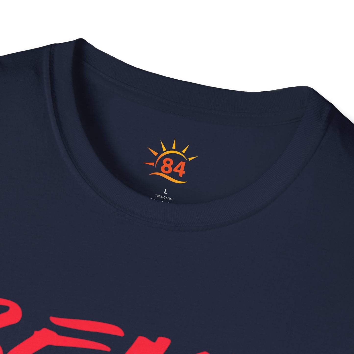 A folded navy blue t-shirt with the text, Beach Club Caribbean and a sun and sea shell graphic image.