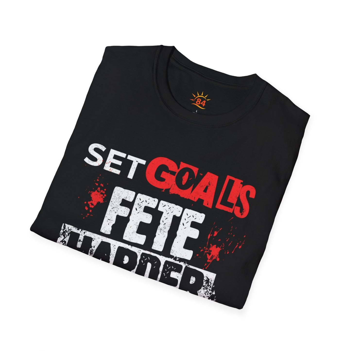 A folded black t-shirt with text, Set Goals Fete Harder on a white background