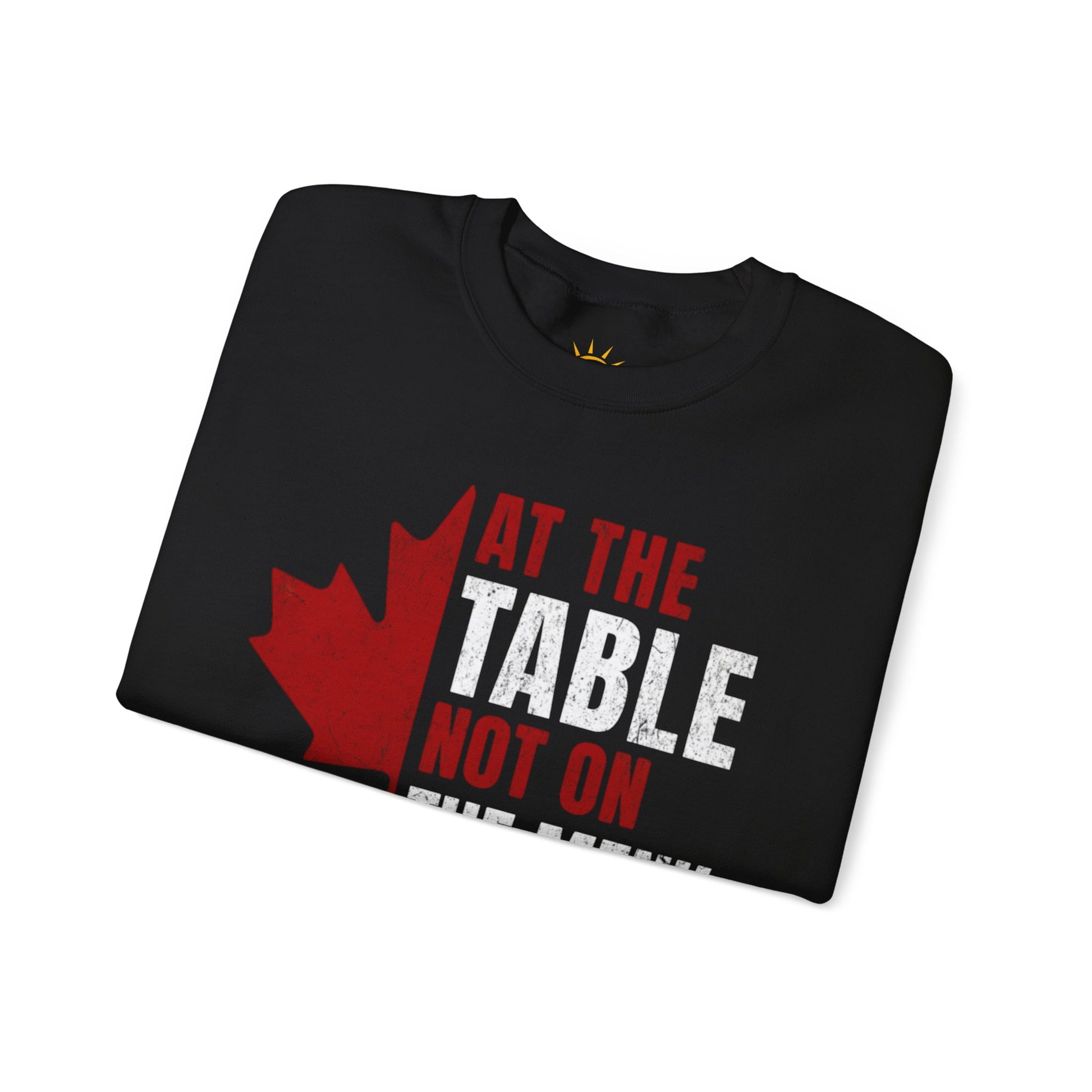 A folded black sweatshirt with a red and white graphic design. We are at the table not on the menu