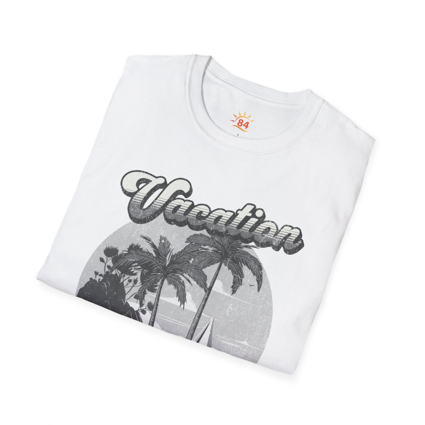 A folded white t-shirt with a graphic print and text that says Vacation - State of Mind - Do not disturb