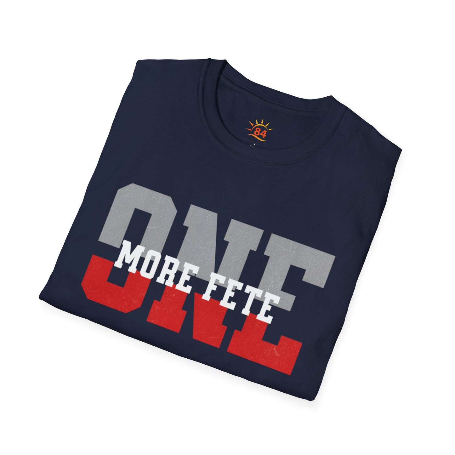 A folded navy blue t-shirt with 'ONE MORE FETE' text on a white background