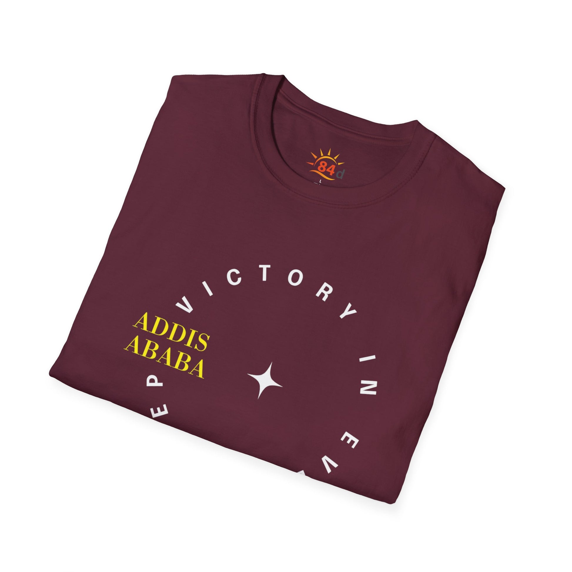 Folded maroon Ethiopian, Addis Ababa, minimalist, t-shirt with yellow and white text on a white background with text and logo on a white background
