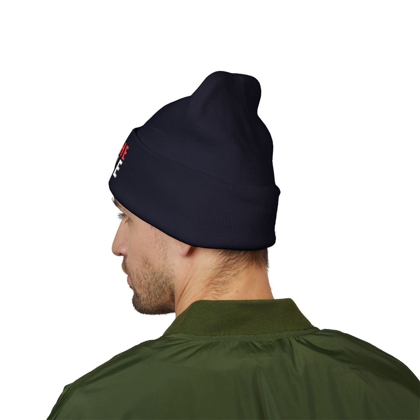 Man wearing a navy beanie with a logo on a white background