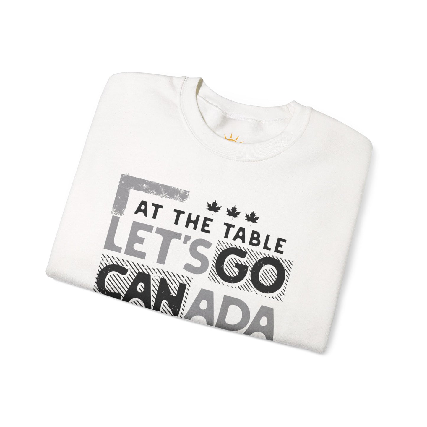 A folded white sweatshirt with text, At the table, Let's Go Canada, Not on the menu.