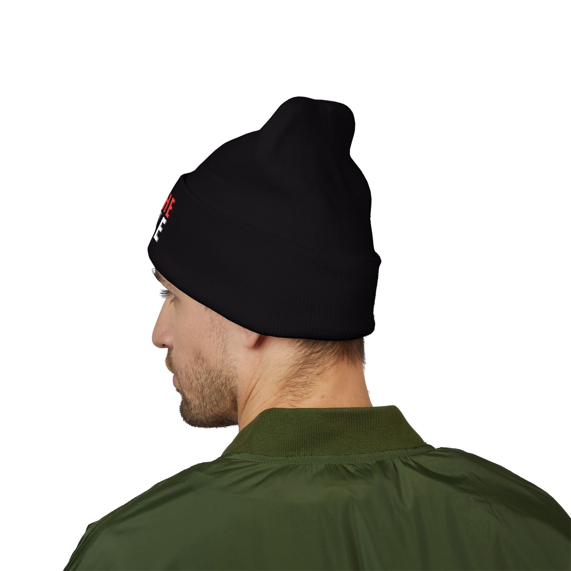 Man wearing a black beanie with a logo on a white background