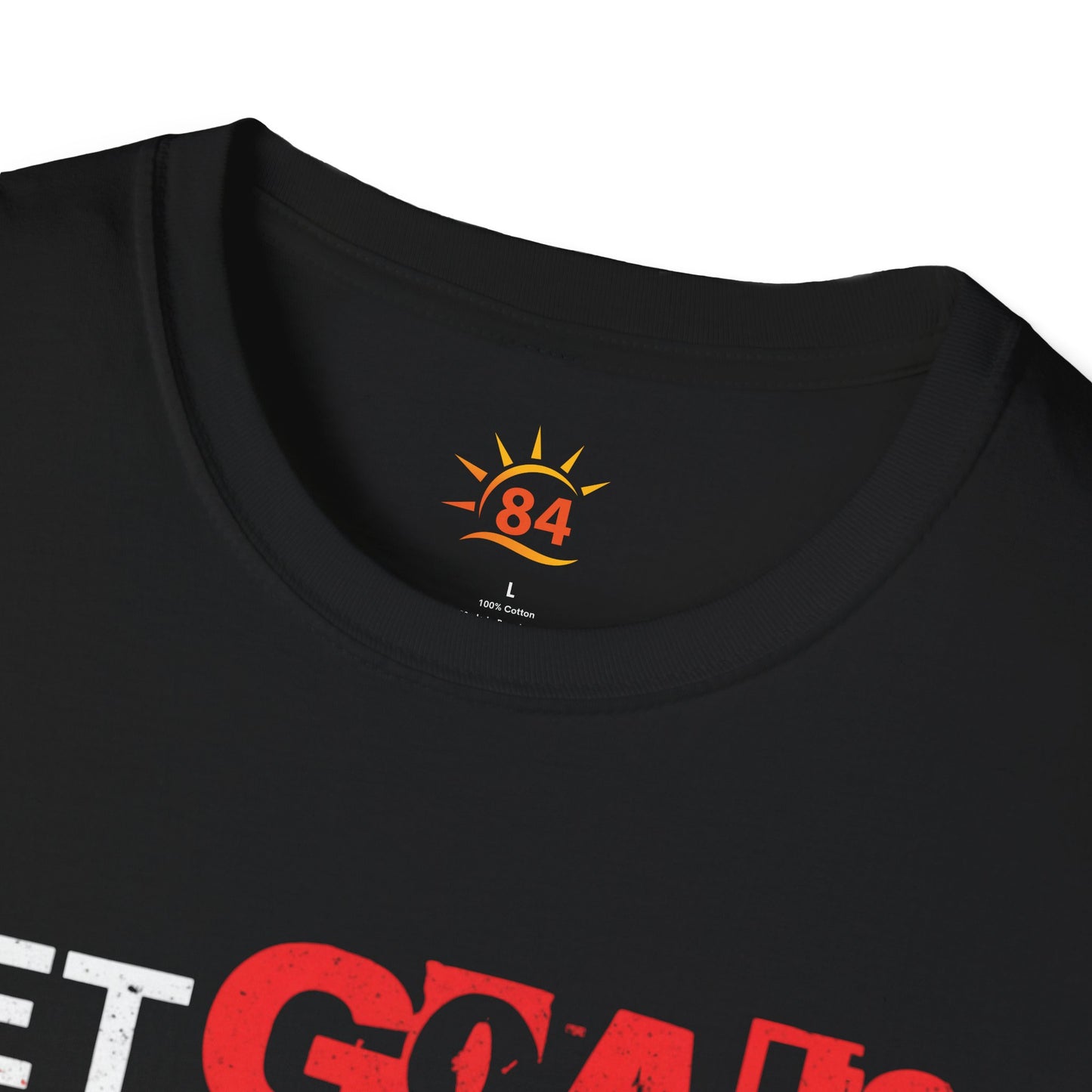 A folded black t-shirt with text, Set Goals Fete Harder on a white background