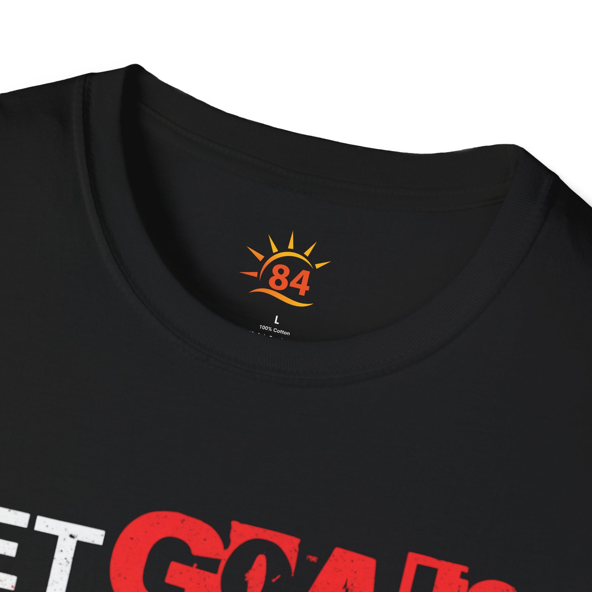 A folded black t-shirt with text, Set Goals Fete Harder on a white background
