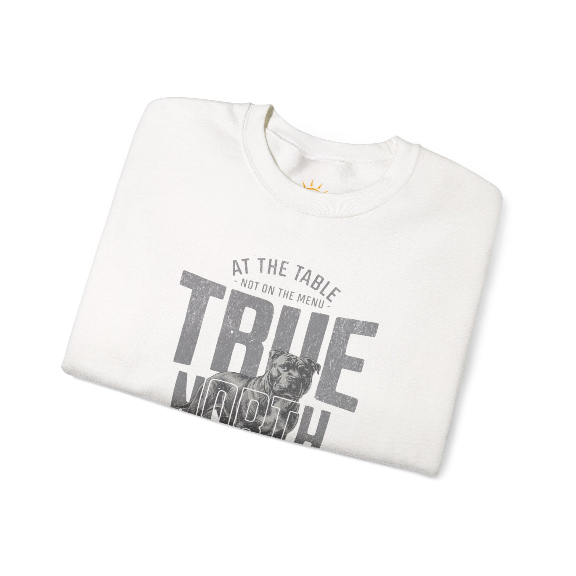 A folded white sweatshirt with text and graphics, True North Strong