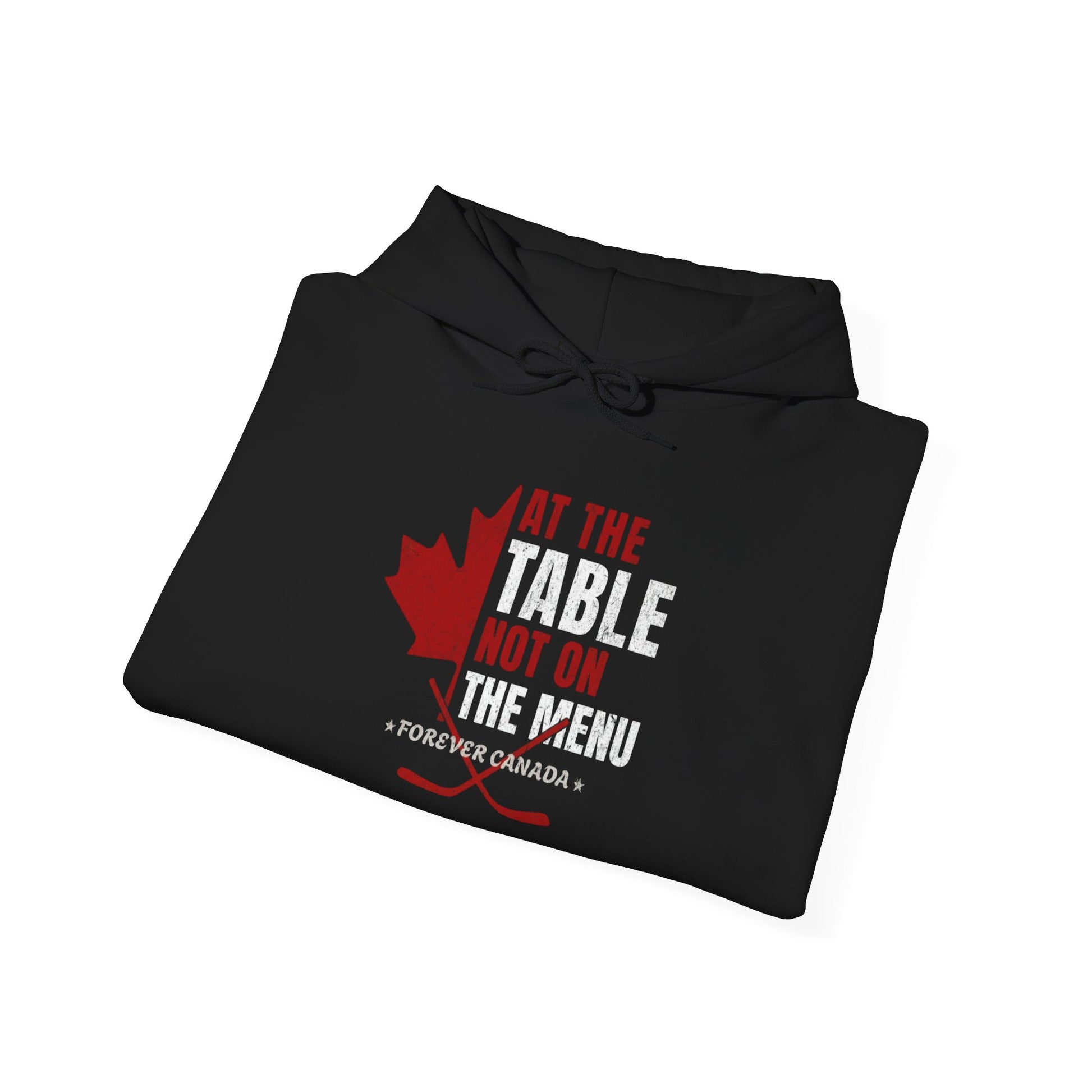 A folded black hoodie with a red and white graphic design. We are at the table not on the menu