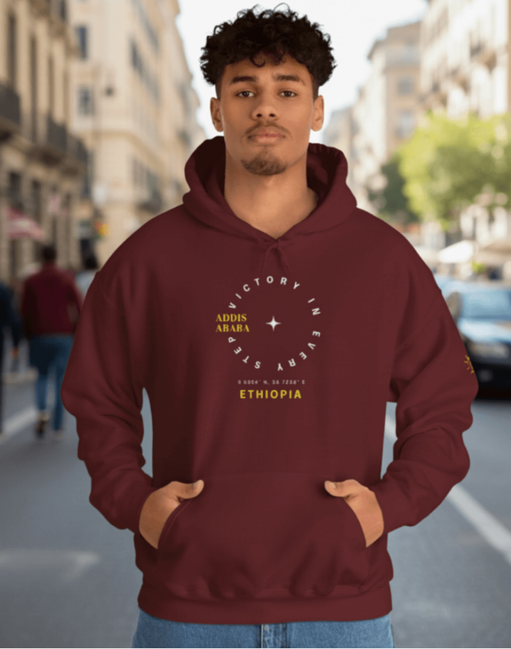 Man wearing a maroon Ethiopian Addis Ababa hoodie with minimalist text design 