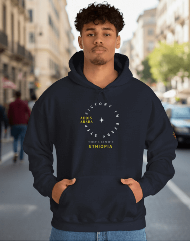 Man wearing a Navy blue Ethiopian Addis Ababa hoodie with minimalist text design 