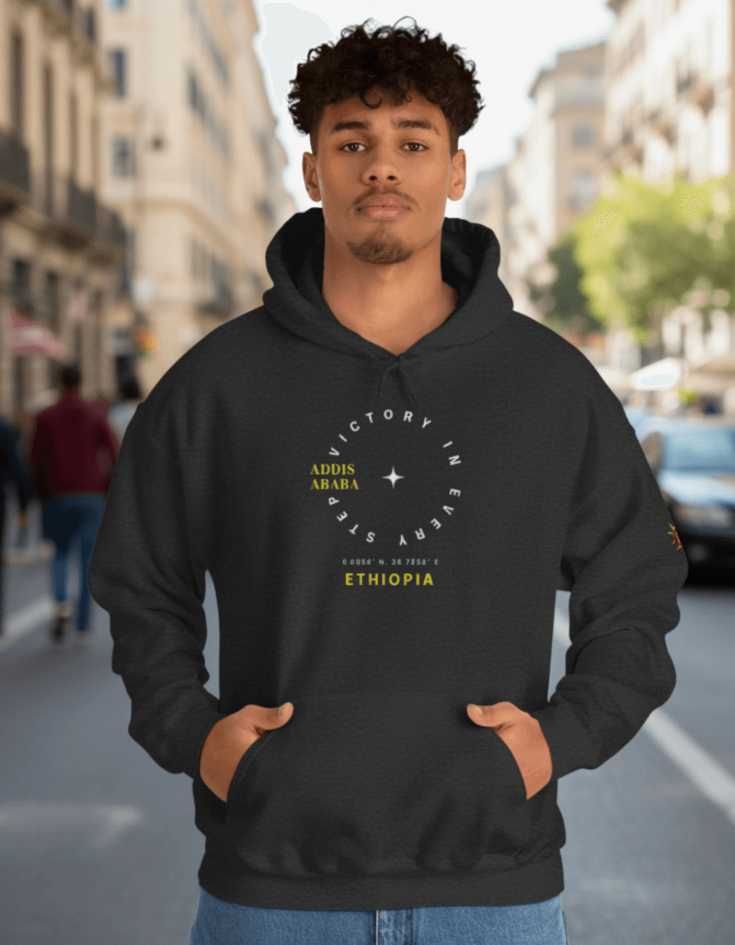 Man wearing a gray Ethiopian Addis Ababa hoodie with minimalist text design 