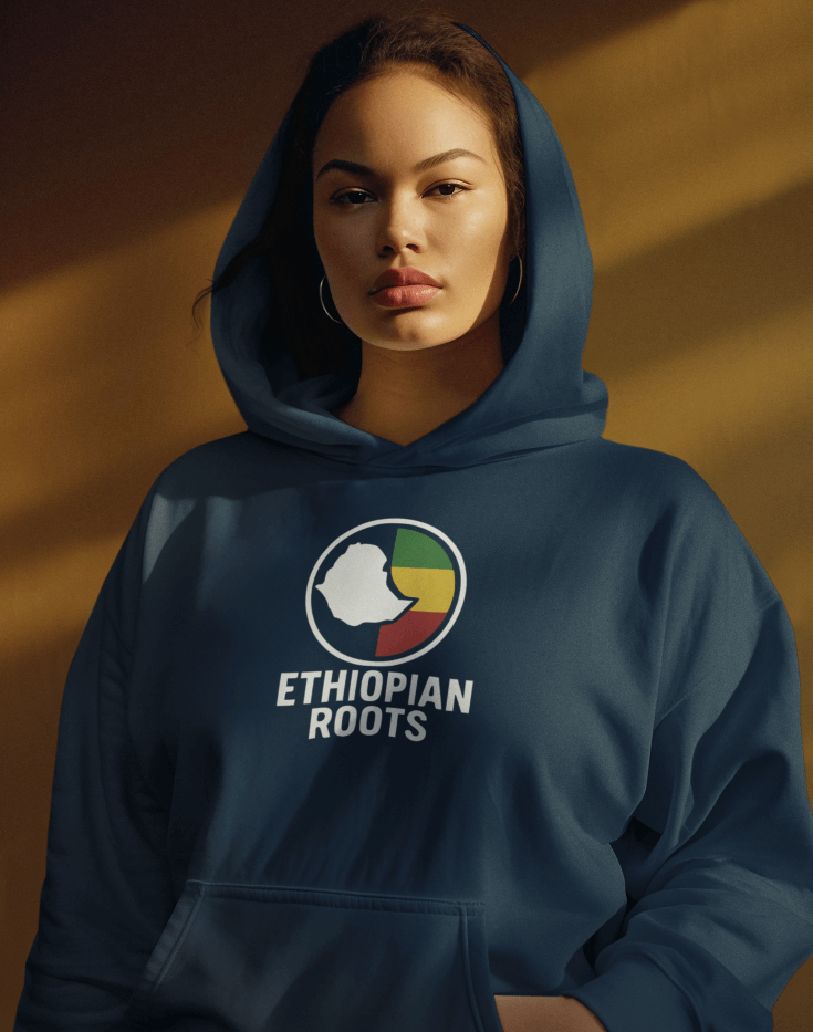Woman wearing a navy blue hoodie with 'Ethiopian Roots' flag and map design on a brown background