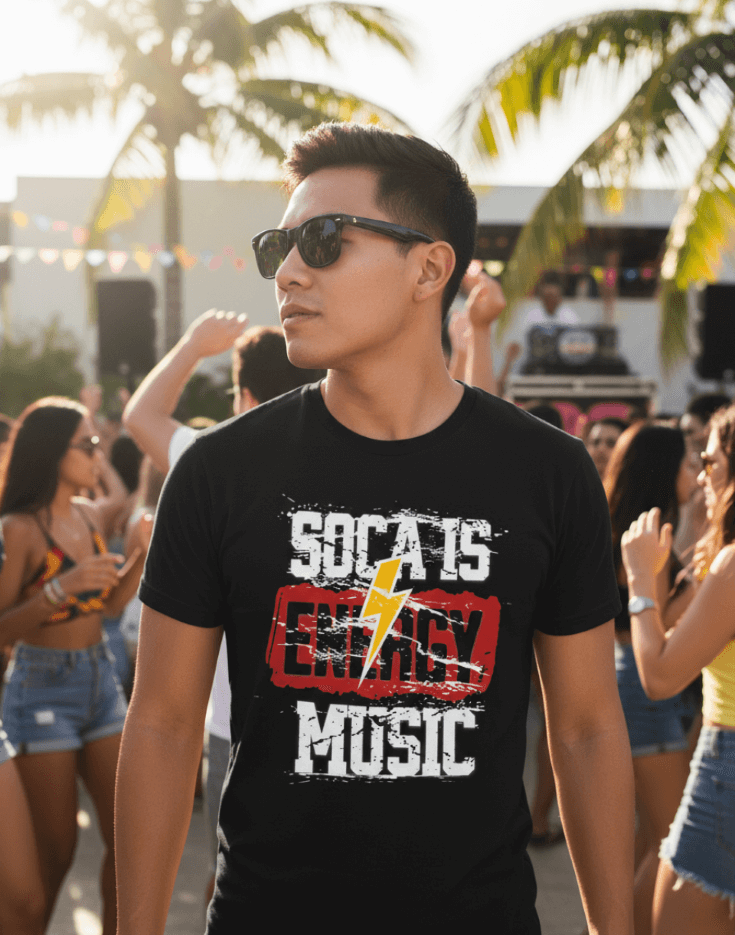 Man wearing a black 'Soca is Energy Music' t-shirt at a Carnival outdoor event with palm trees.