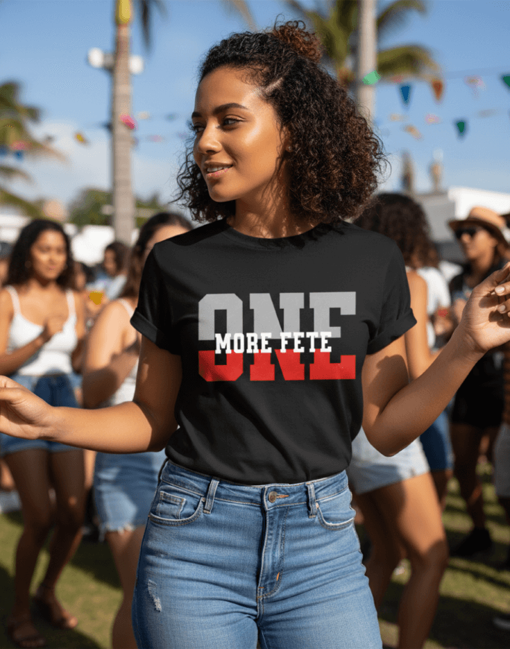 Woman wearing a black t-shirt with 'ONE MORE FETE' text at an outdoor event.
