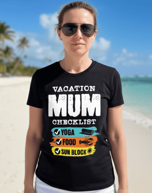Woman wearing a black t-shirt with 'VACATION MUM CHECKLIST' text and bold text and graphics