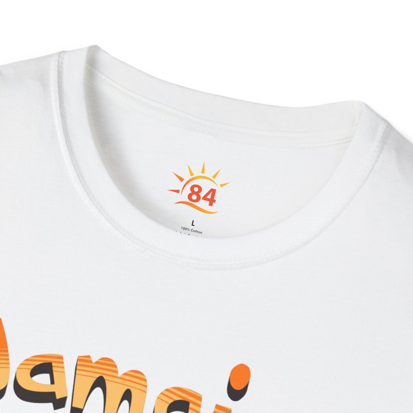 A folded white t-shirt with Jamaica Vibes text and Jamaica flag reggae inspired graphic. 