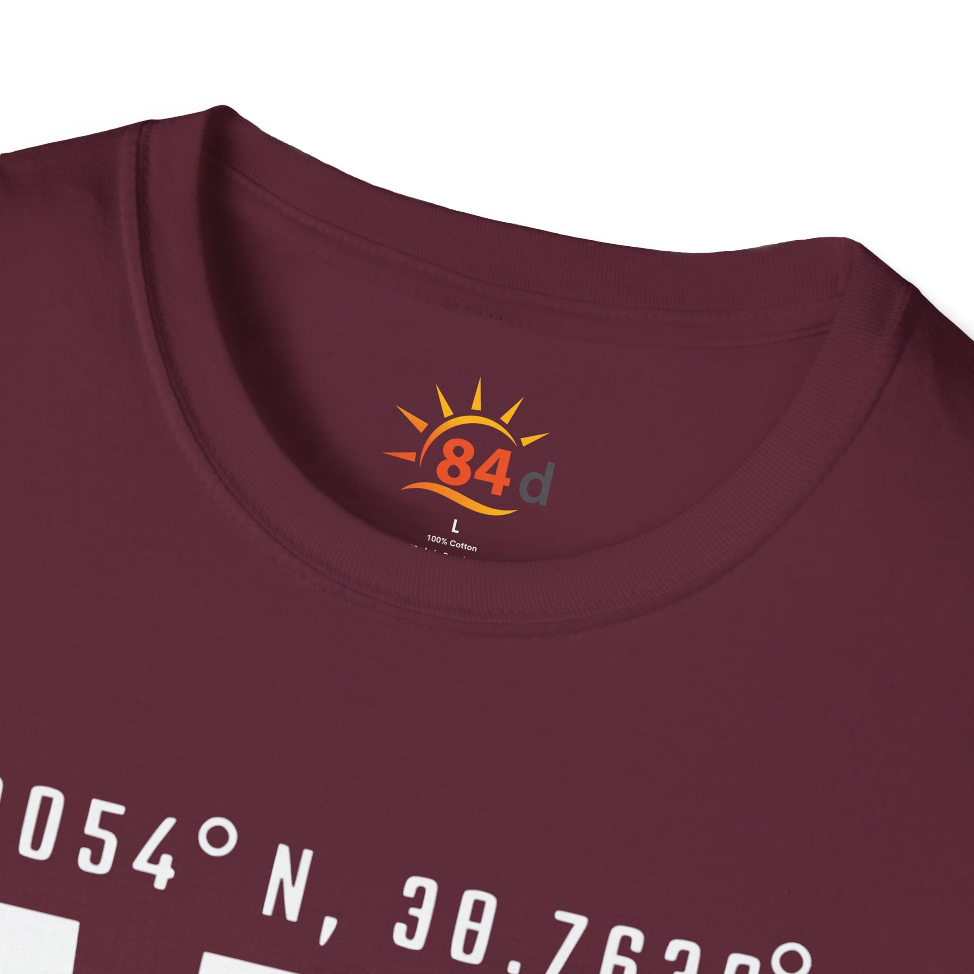 A folded maroon t-shirt with Addis Ababa, Ethiopia, ADD Airport code and coordinates.