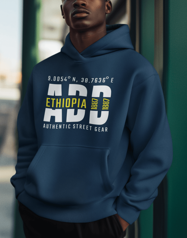 Man wearing a blue hoodie with Addis Ababa, Ethiopia, ADD Airport code and coordinates on a blurred background