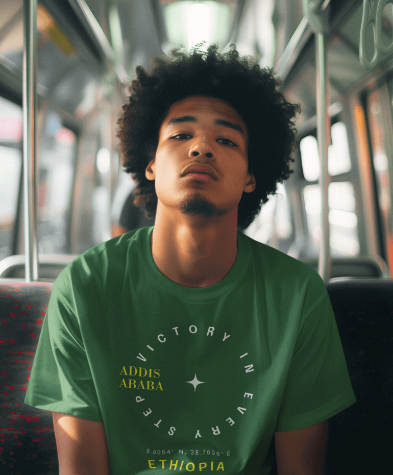 Man wearing a green Ethiopian Addis Ababa t-shirt with minimalist text sitting on a bus