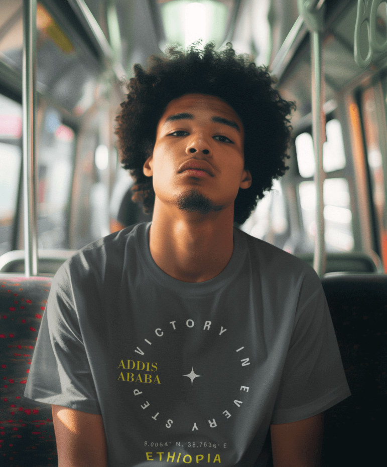 Man wearing a gray Ethiopian Addis Ababa t-shirt with minimalist text sitting on a bus