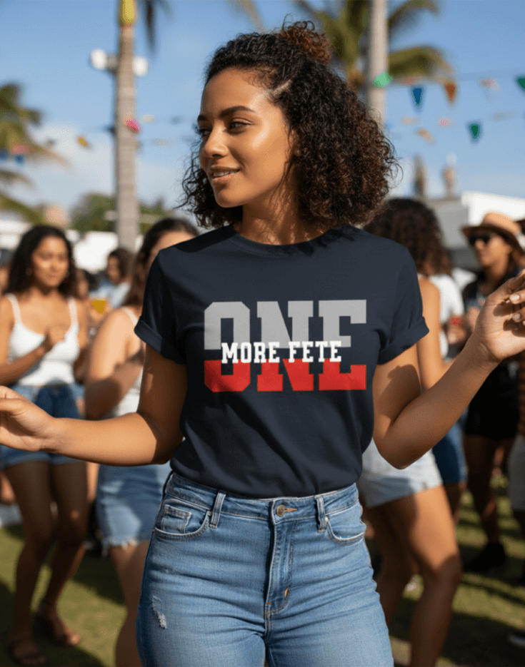 Woman wearing a navy blue t-shirt with 'ONE MORE FETE' text at an outdoor event.