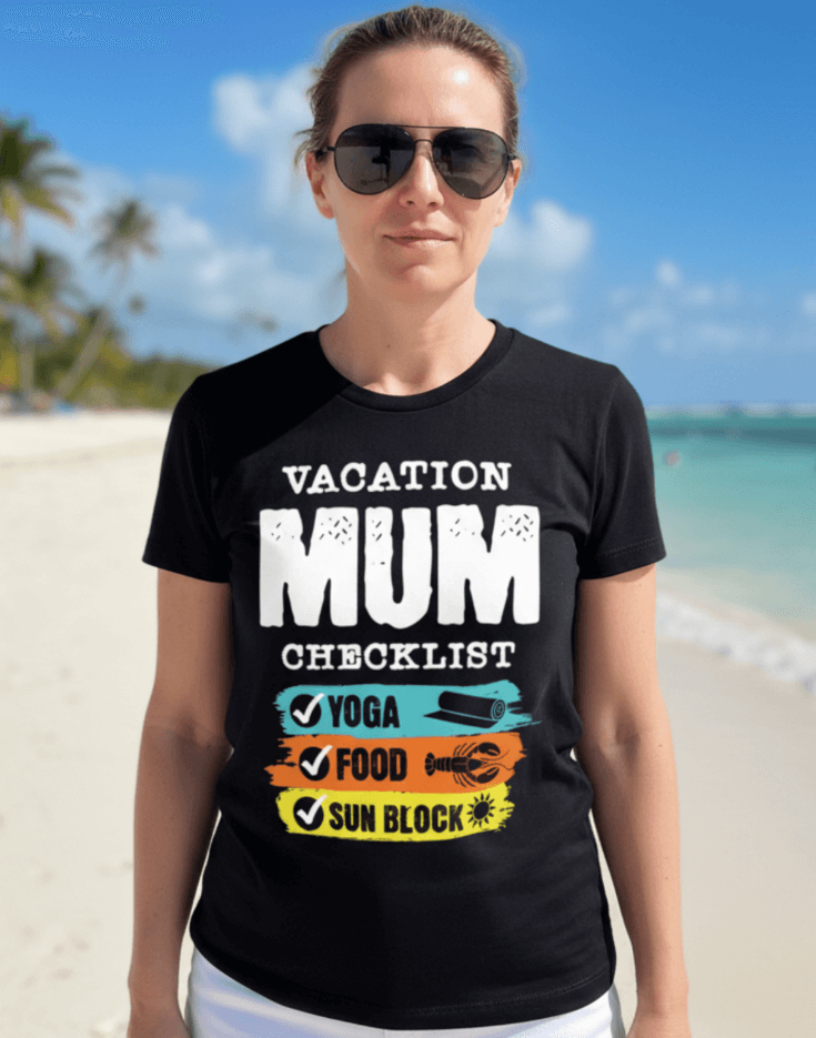 Woman wearing a black t-shirt with 'VACATION MUM CHECKLIST' text and bold text and graphics