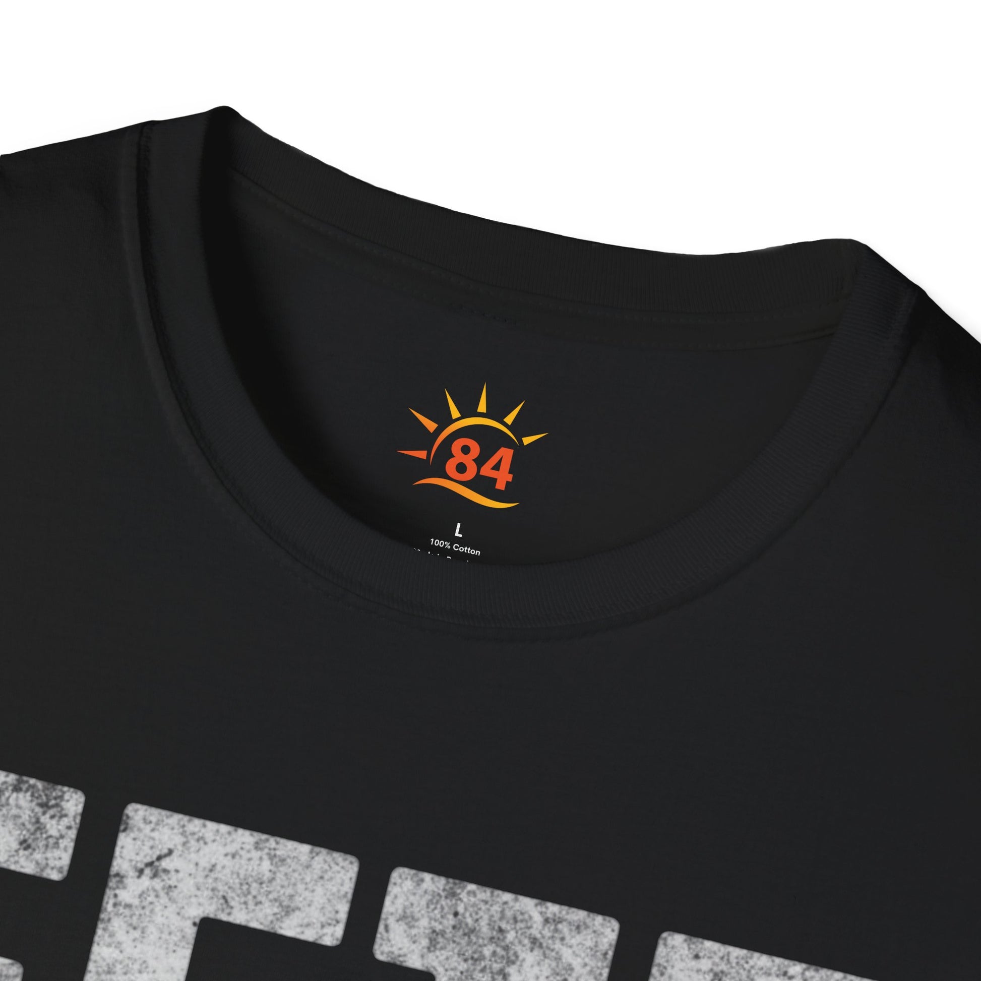 Folded Black t-shirt with 'FETE MODE ON' text on a white background