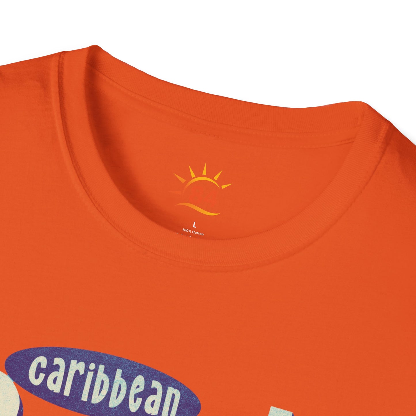 A folded orange t-shirt that says Caribbean Sunsets, Rum Punch Dreams with a beach sunset graphic.