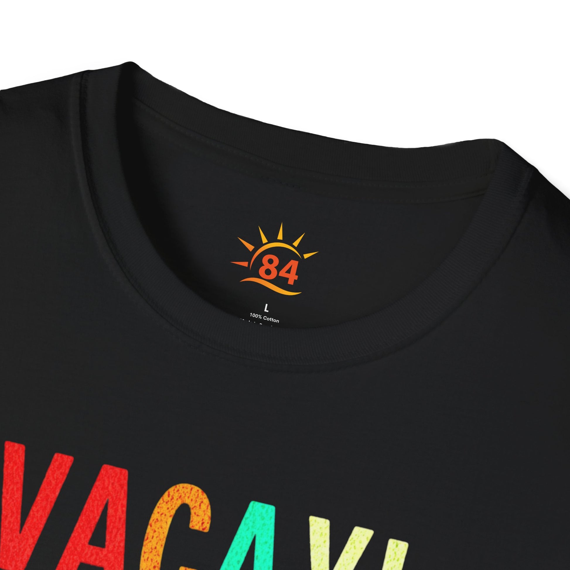 A folded black t-shirt with 'VACAY! TIME TO BEACH' text and palm tree graphics