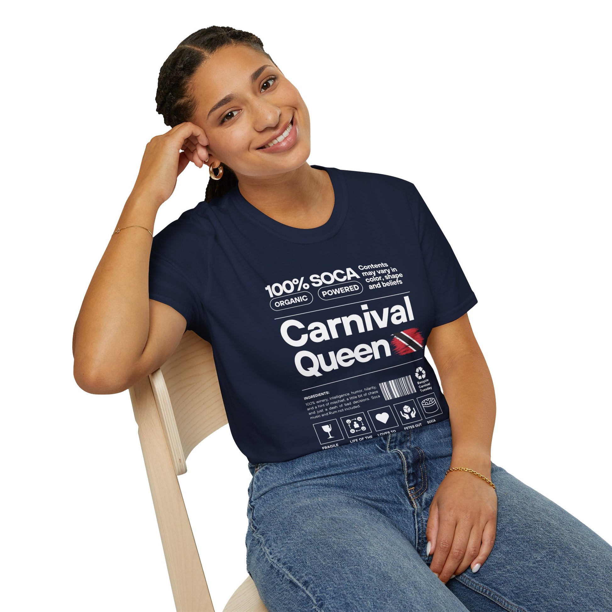 Woman wearing a navy blue t-shirt with 'Carnival Queen' text and graphics, sitting on a chair.