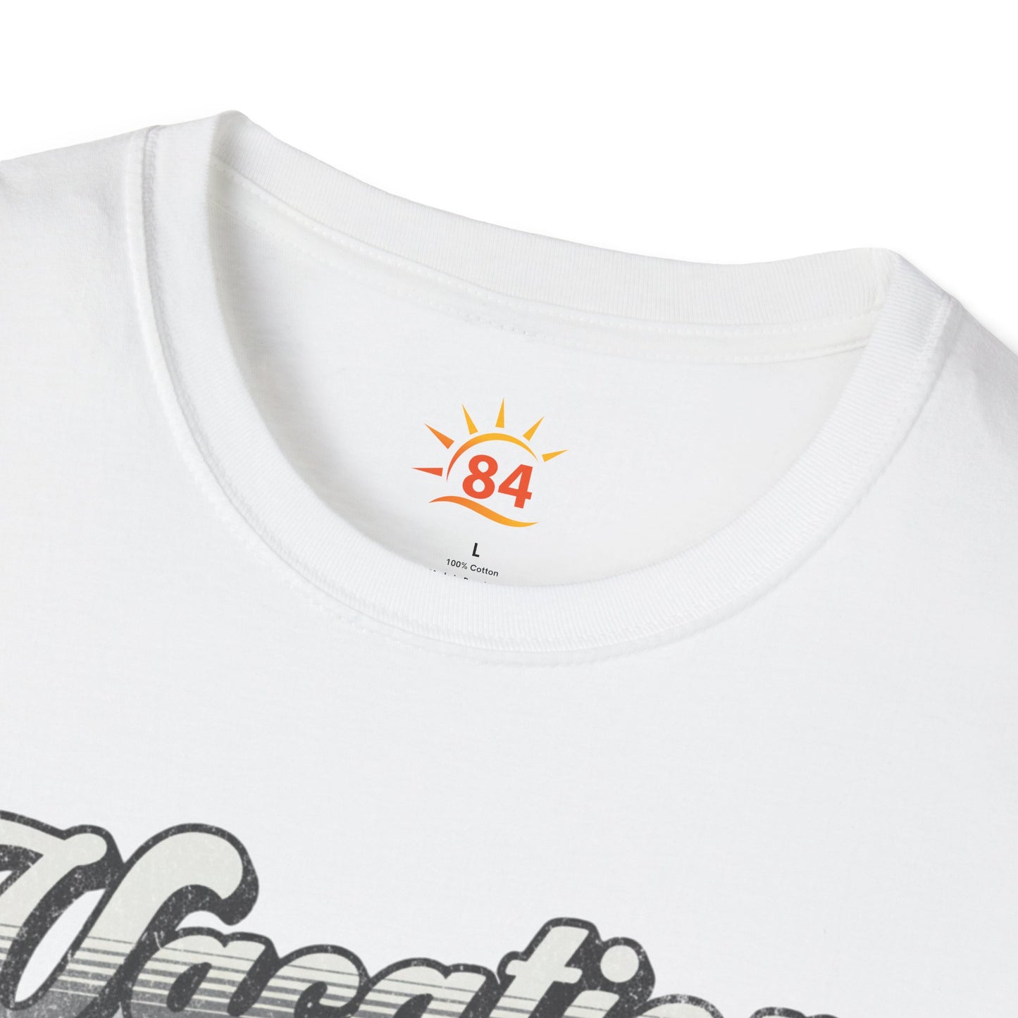 A folded white t-shirt with a graphic print and text that says Vacation - State of Mind - Do not disturb