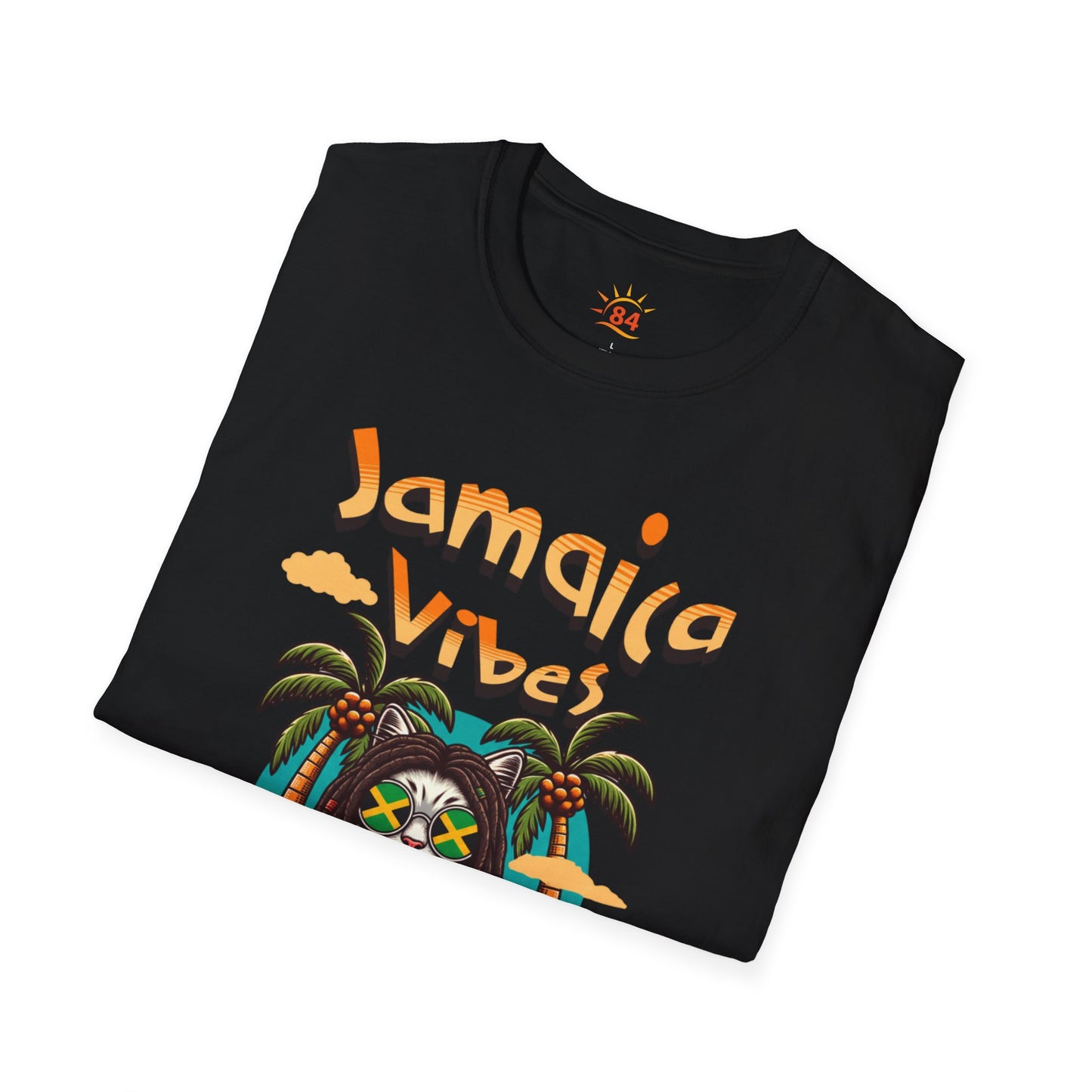 A folded black t-shirt with Jamaica Vibes text and Jamaica flag reggae inspired graphic. 