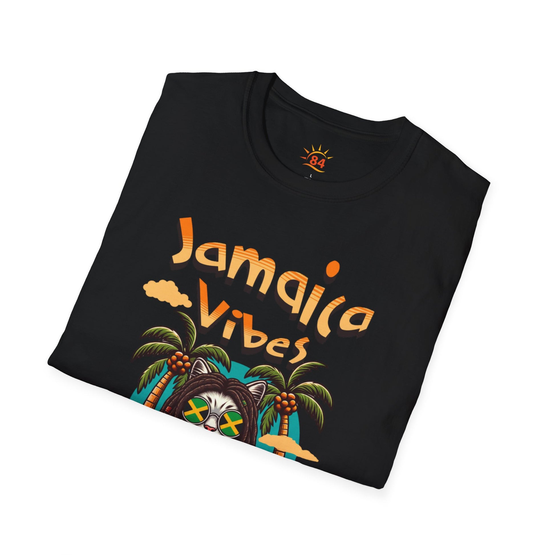 A folded black t-shirt with Jamaica Vibes text and Jamaica flag reggae inspired graphic. 