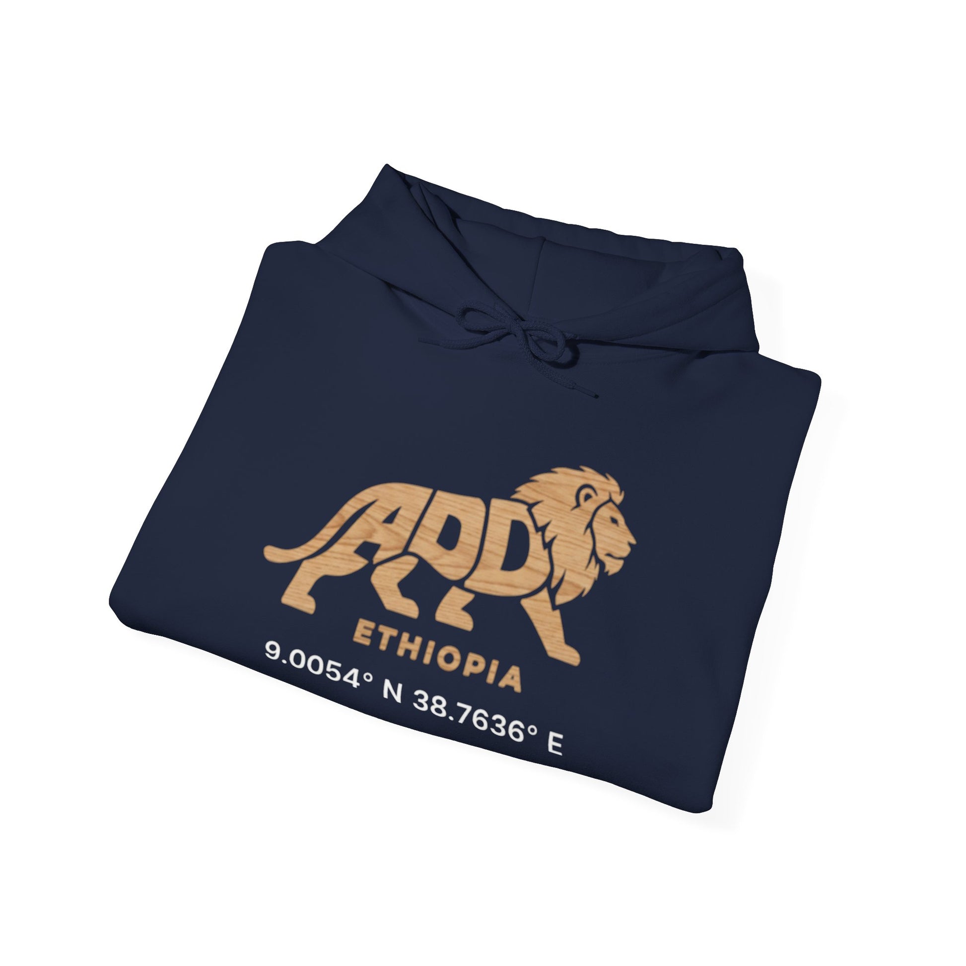 A folded navy blue hoodie with a lion logo and Addis Ababa, Ethiopia coordinates sitting at a bar.
