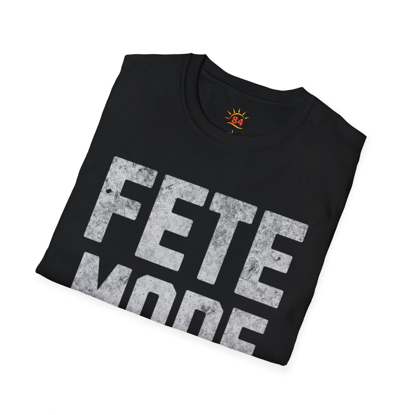 Folded Black t-shirt with 'FETE MODE ON' text on a white background