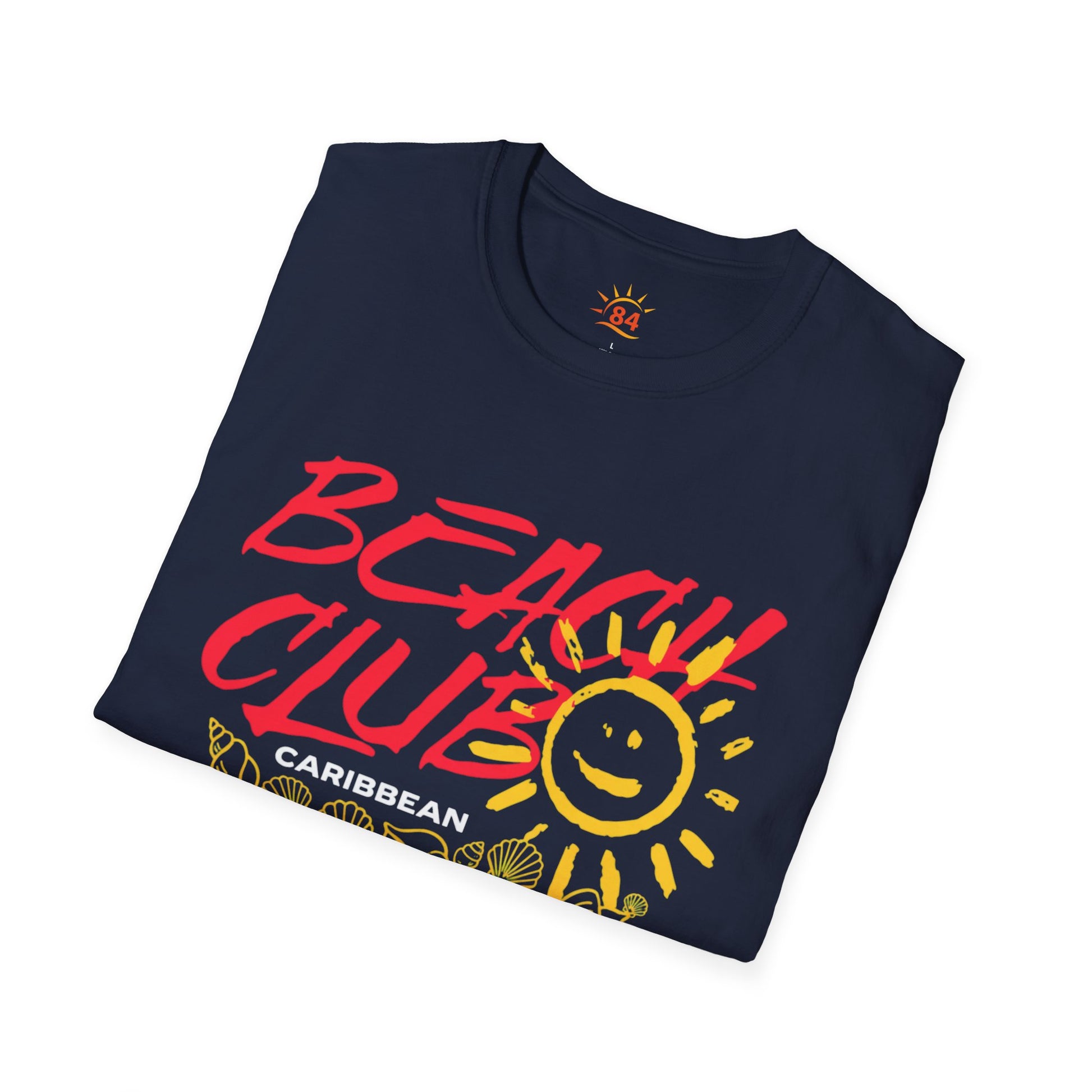 A folded navy blue t-shirt with the text, Beach Club Caribbean and a sun and sea shell graphic image.