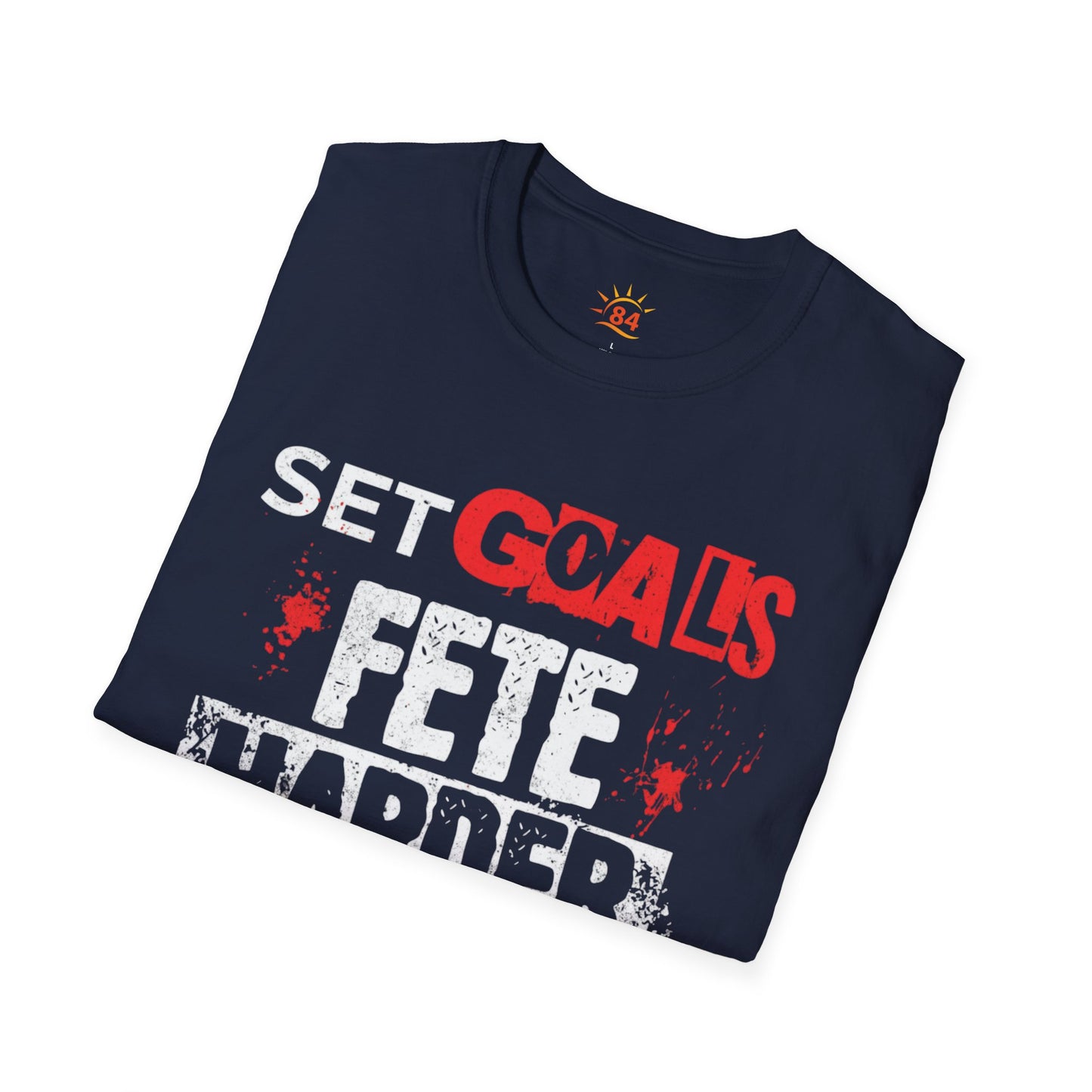 A folded navy blue t-shirt with text, Set Goals Fete Harder on a white background