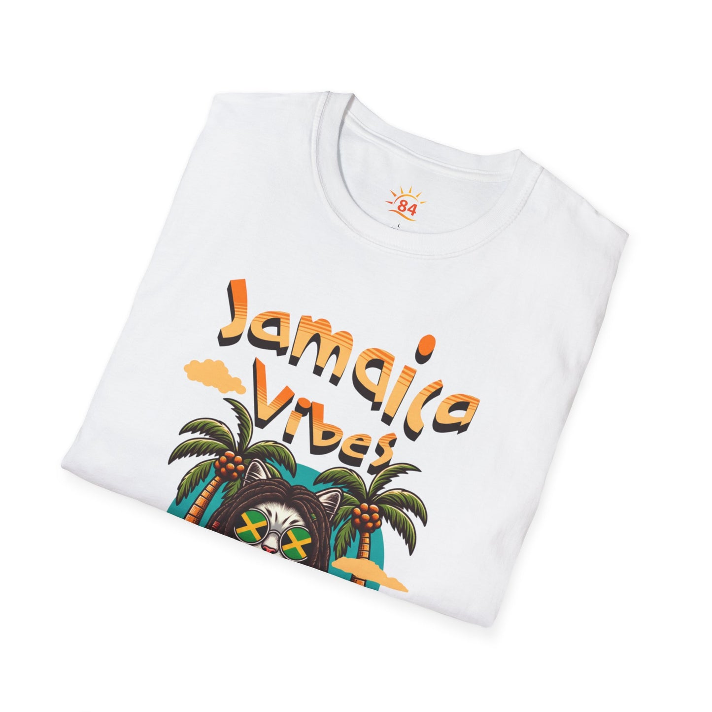 A folded white t-shirt with Jamaica Vibes text and Jamaica flag reggae inspired graphic. 