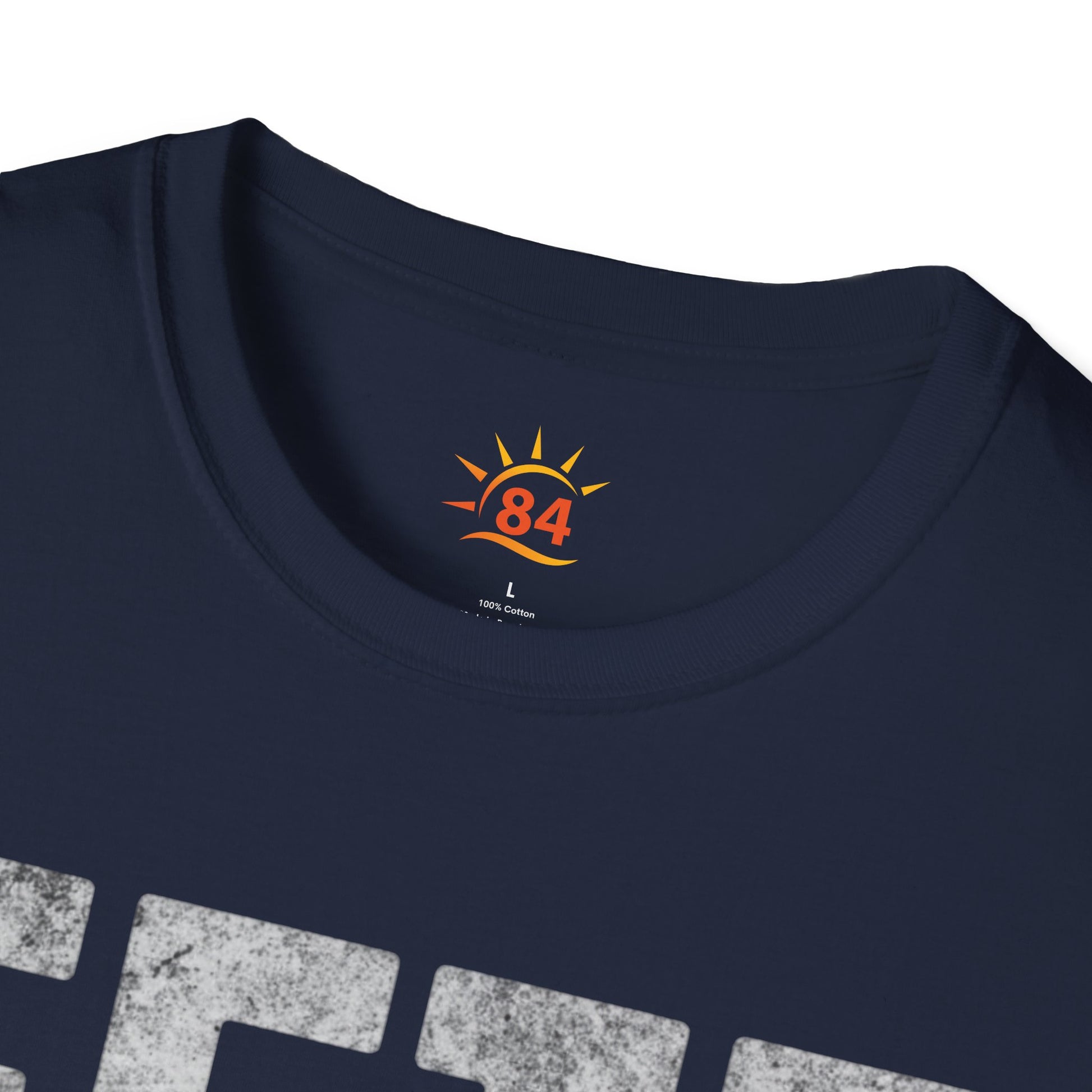 Folded Navy blue t-shirt with 'FETE MODE ON' text on a white background