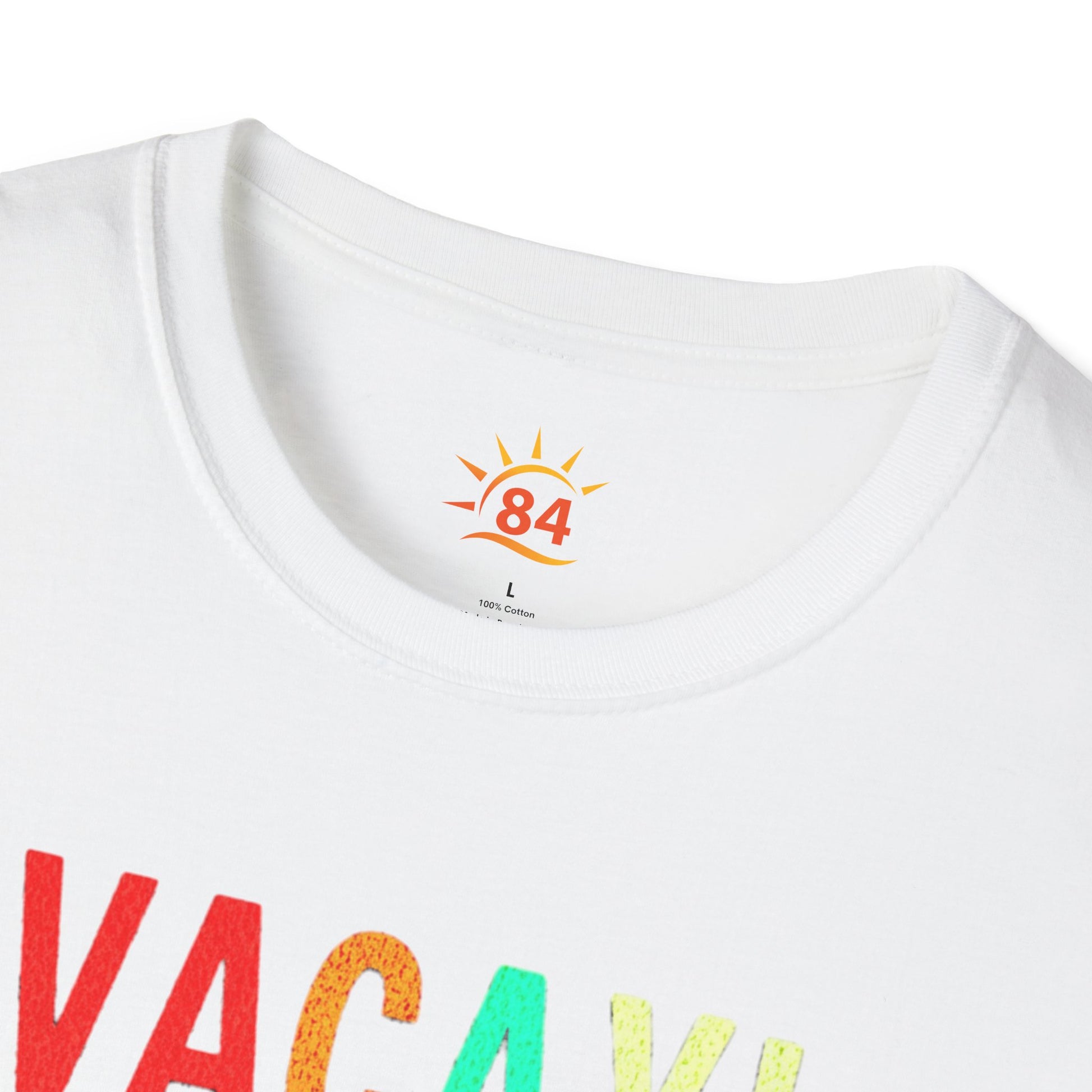 a folded white t-shirt with 'VACAY! TIME TO BEACH' text and palm tree graphics 