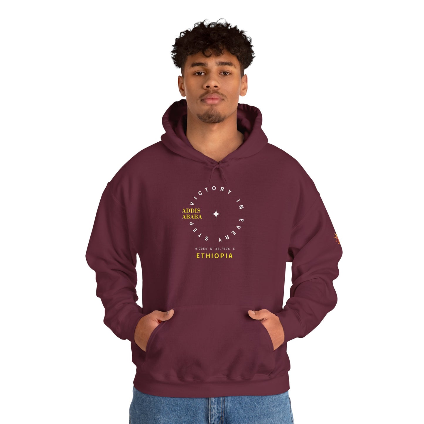 Man wearing a maroon Ethiopian Addis Ababa hoodie with minimalist text design 